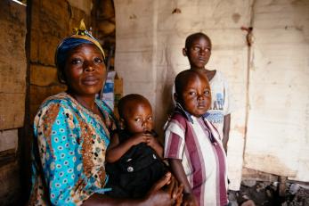 A woman with three children in drc