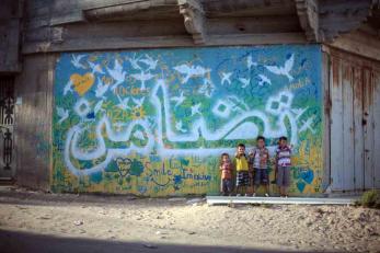 Through an art therapy project, youth in Gaza learned how to express themselves and created 11 colorful murals to beautify their communities. Photo: Samantha Robinson/aptART