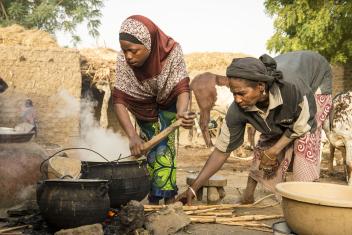 9:07 a.m. — Most of Badariya’s morning is spent cooking with her mother: finding wood, tending the fire and stirring the grains. “I also take some food to my grandmother, who is blind and can’t see,” she explains.