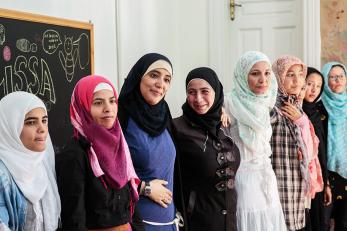 Young women refugees standing side by side