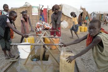 People in south sudan gather to fill water containers