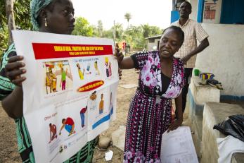 Women presenting ebola poster in liberia