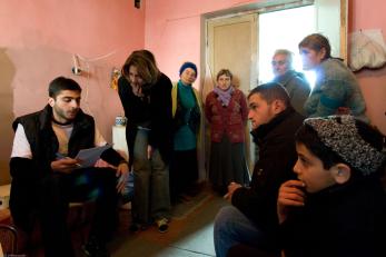 A former school building now being housed with IDP's from the Gori area who were dislocated by the bombing. Mercy Corps staff meet with them to assess their winterization needs. Photo: Jeffrey Austin for Mercy Corps