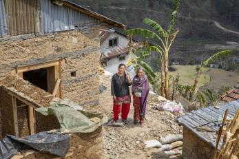 women standing by home in nepal