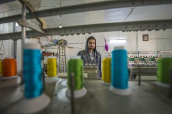 Photos 1 and 2, Bashar in 2015, working at a small textile factory in northern Jordan. Photos 3 and 4, Bashar in 2018, still working 70-hour weeks at the factory. PHOTOS: Peter Biro and Annie Sakkab for Mercy Corps