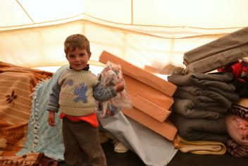 Living in such close quarters, families take pains to keep their space tidy and orderly. Mattresses and blankets are stacked off to the side during the day, clothes bundled into bags.