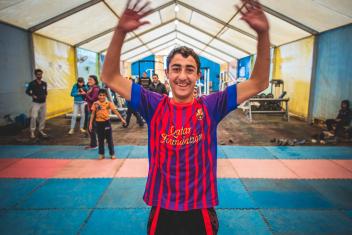 The soccer, weightlifting and other physical activities held at the child-friendly spaces help young refugees like Islam, 15, and Yousef, 15, expel stress and energy. Photo: Sean Sheridan/Mercy Corps