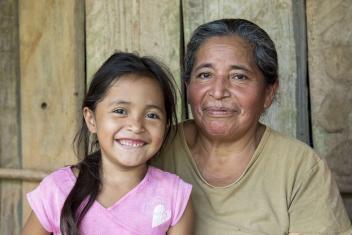 Mercy Corps and The Starbucks Foundation are creating an impact that lasts generations. Through Community Health and Advancement Initiative (CHAI) trainings in Guatemala, Otilia gained skills that benefited her entire family, including her mother and granddaughter, shown here. Otilia learned crop diversification, planting techniques, and breadmaking to further her family business.